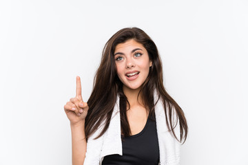 Teenager sport girl over isolated white background pointing with the index finger a great idea