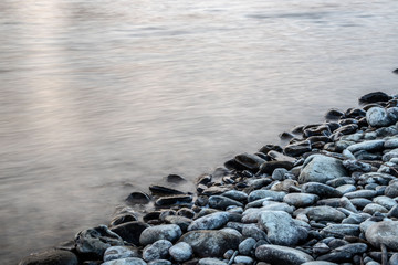 Shore stones covered in water
