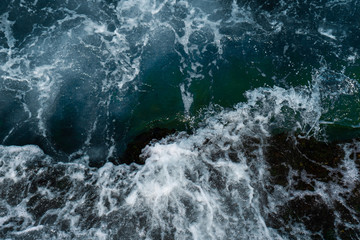 Fototapeta na wymiar The waves in the sea background