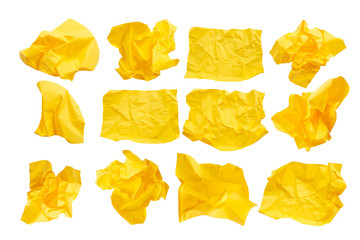 Close-up group of yellow crumpled paper isolated on a white background