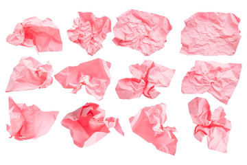 Close-up group of pink crumpled paper isolated on a white background