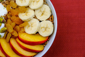 Healthy Vegetarian Breakfast Bowl of Muesli Fruit and Nuts With Yogurt