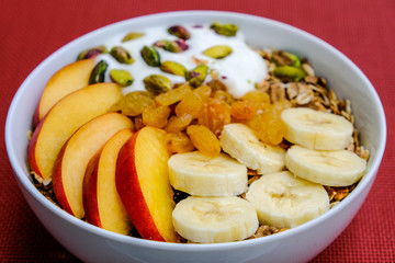 Healthy Vegetarian Breakfast Bowl of Muesli Fruit and Nuts With Yogurt