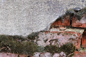 Close up view on aged and weathered conrete walls with cracks in high resolution