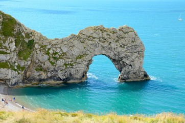 Durdle Door is a natural limestone arch on the Jurassic Coast in Dorset, England