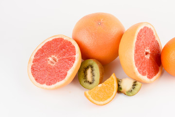 Mix of orange, kiwi, grapefruit on white background. Citrus fruit. Healthy freshness food. Orange fruit with vitamin