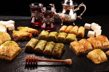Middle eastern or arabic dishes. Turkish Dessert Baklava with pistachio on dishes