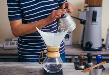 Professional barista preparing coffee alternative method