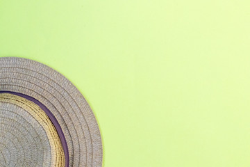 Hat on a yellow background, summer holidays mood, top view