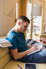 Fototapeta premium Man taking notes