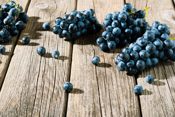 red grapes on old weathered wooden table