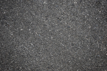 A smooth dark grey asphalt pavement texture with small rocks,Asphalt Dark Texture for Roads,Soil texture background