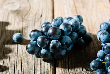 red grapes on old weathered wooden table