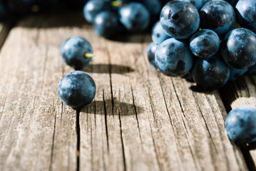 red grapes on old weathered wooden table