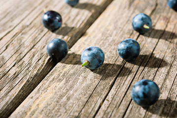 red grapes on old weathered wooden table