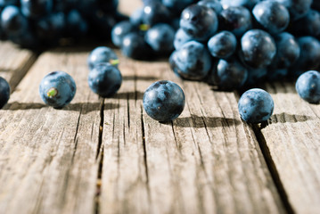 red grapes on old weathered wooden table