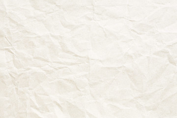 Fototapeta premium Old pale yellow crumpled paper background texture