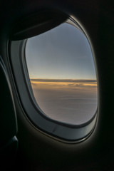 view from aircraft window during sunrise