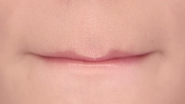 Lips of a beautiful girl close up