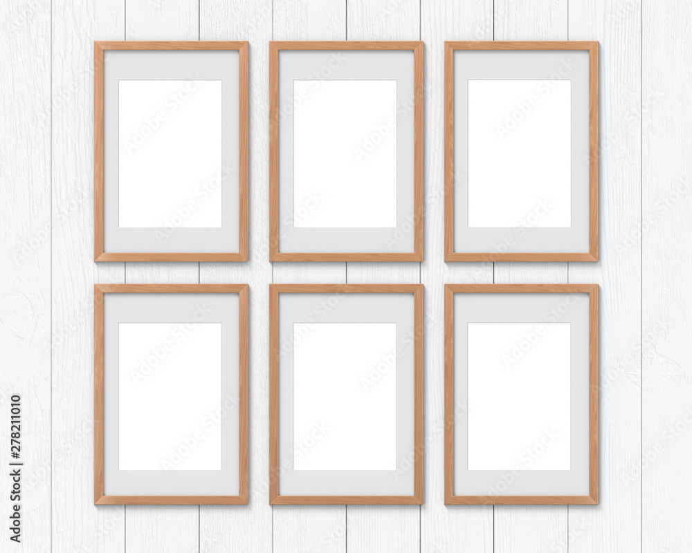Poster set of 6 vertical wooden frames mockup with a border hanging on the wall. empty base for picture or 