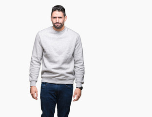 Young handsome man wearing sweatshirt over isolated background depressed and worry for distress, crying angry and afraid. Sad expression.