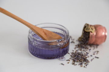 the lavender jam and wooden spoon and copper plate on the white background for kitchen service concept from Isparta lavender fields.