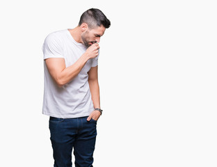 Fototapeta premium Young man wearing casual white t-shirt over isolated background feeling unwell and coughing as symptom for cold or bronchitis. Healthcare concept.