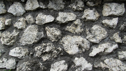 background of gray stone. the wall of a large old gray stone. stone wall texture