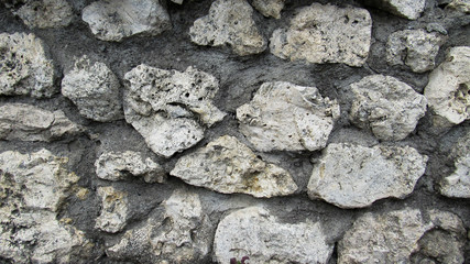 background of gray stone. the wall of a large old gray stone. stone wall texture