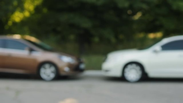 Man gives a car key to the other man