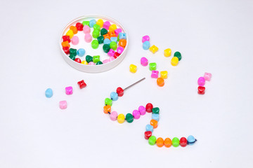 Plastic multicolored beads. Homemade game for children development concept.