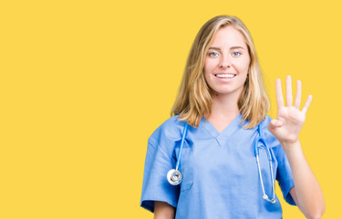Beautiful young doctor woman wearing medical uniform over isolated background showing and pointing...