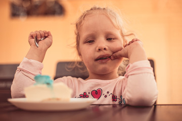 Fototapeta premium children with gusto eat tasty dessert