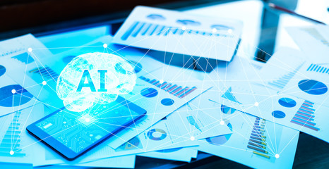 Business technology and AI(Artificial Intelligence) concept.The tablet with AI brain and stock market graph.