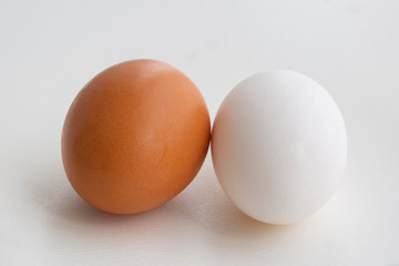Chicken eggs for cooking. White and brown eggs.