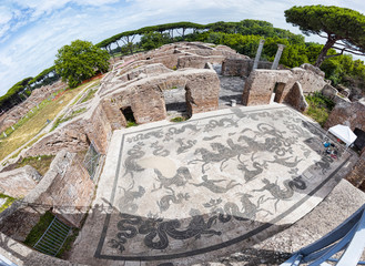 Panoramic view of the thermal baths of Neptune in the archaeological excavations of Ostia Antica with the famous mosaic depicting the Triumph of Neptune  © Equatore