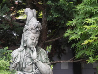 Fototapeta premium Quan Yin sculpture in garden