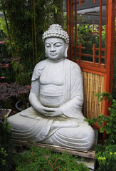 Buddha sculpture in bamboo garden