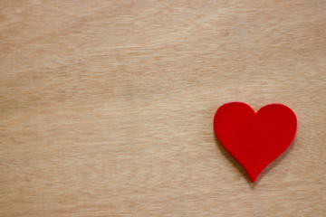 One of the red heart on the table wood