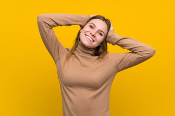 Young woman over colorful background laughing