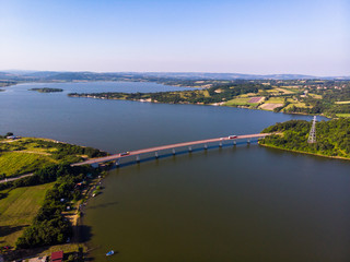 Fototapeta na wymiar Aerial view of lake, forest and agriculture field by the water, at summer. Gruza lake near the Kragujevac in Serbia.