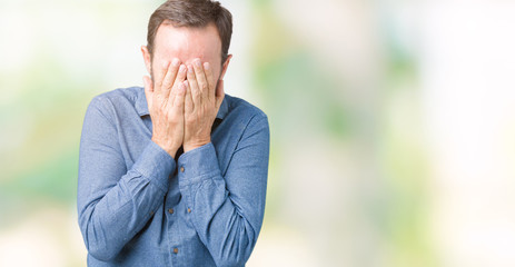 Handsome middle age elegant senior man over isolated background with sad expression covering face...