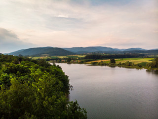Fototapeta na wymiar Aerial view of lake, forest and agriculture field by the water, at summer. Gruza lake near the Kragujevac in Serbia.