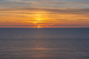 Fototapeta premium Etretat, France - 05 31 2019: sunset over the sea of Etretat