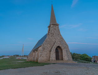 Etretat, France - 05 31 2019: Fishermen's Chapel on the top of the cliffs of Etretat