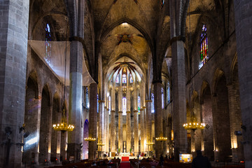 Interior of Santa Maria del Mar Basilica in typical Catalan Gothic style with pointed arches and high columns. La Ribera, Barcelona.