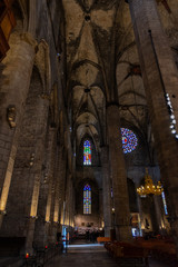 Detail of a lateral nave inside Basilica Santa Maria del Mar with colourful glass windows of the...