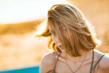 bright picture of beautiful woman on a beach