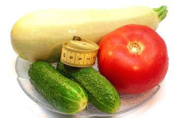 Fresh vegetables in a plate isolated on white background