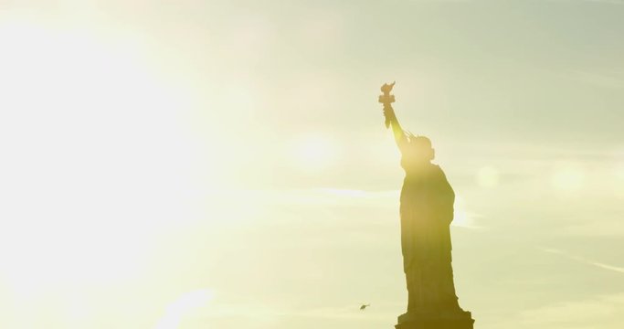 The Patriotic Silhouette Of Iconic Statue Of Liberty In Classic Beautiful New York In The Evening